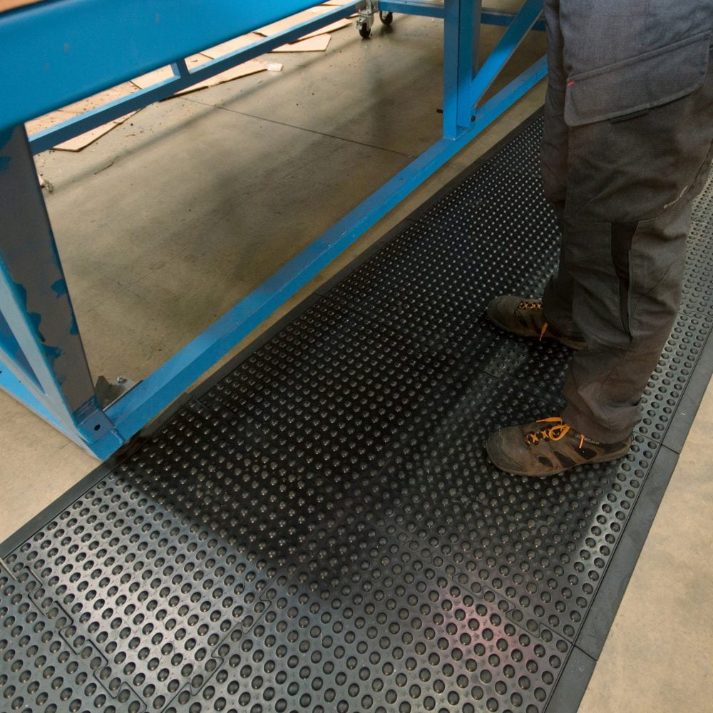 Worker-standing-beside-bench- standing-on-a-black-Bubblemat- Connect