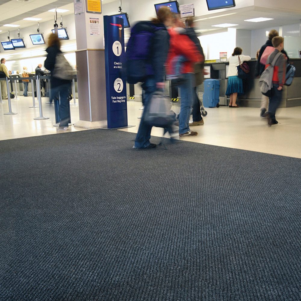 People-walking-across-a-Toughrib- Diagonal-Entrance-Carpet-in-an-airport
