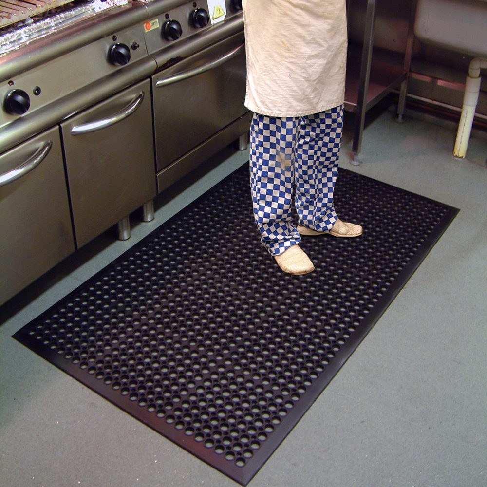 chef-standing-next-to-kitchen-appliances-on-a-black-high-duty-mat